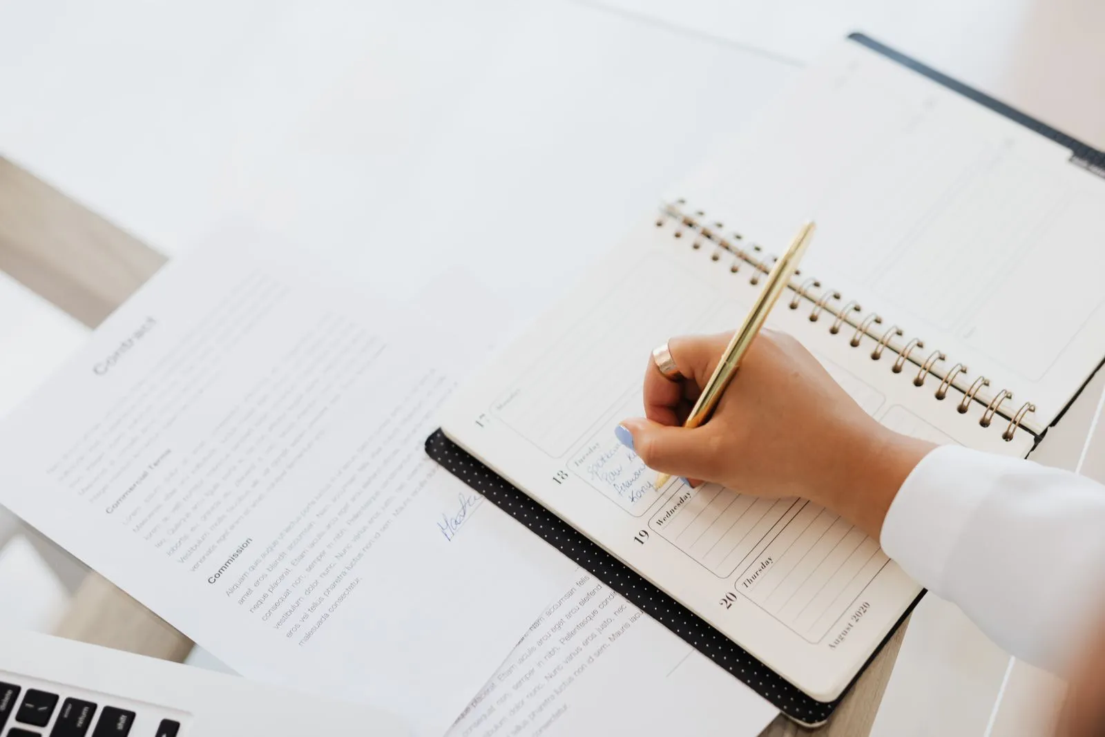 A person checking a calendar while planning a daily habit