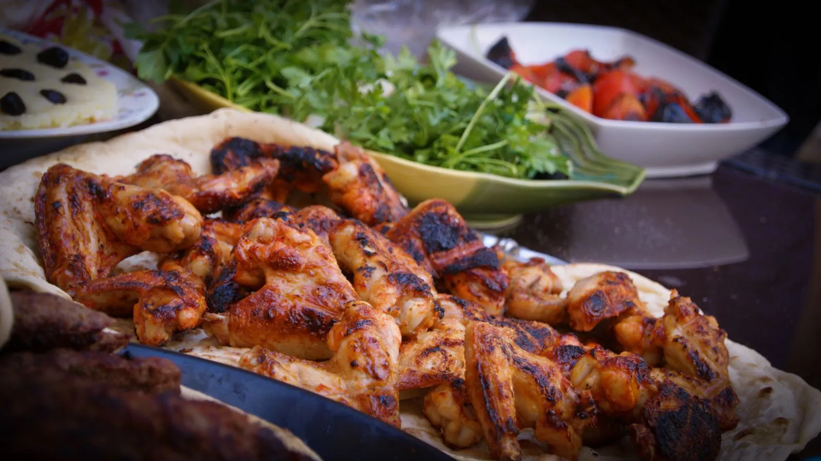 A plate of grilled chicken with vegetables
